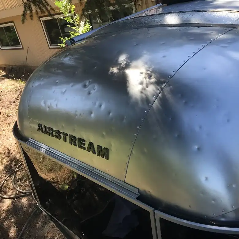 Hail dents concentrated on the hood and windshield often total RVs.