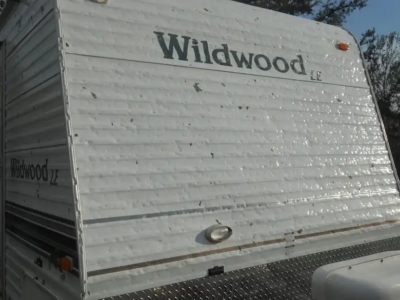 Widespread hail dents on the siding may prompt a total RV loss